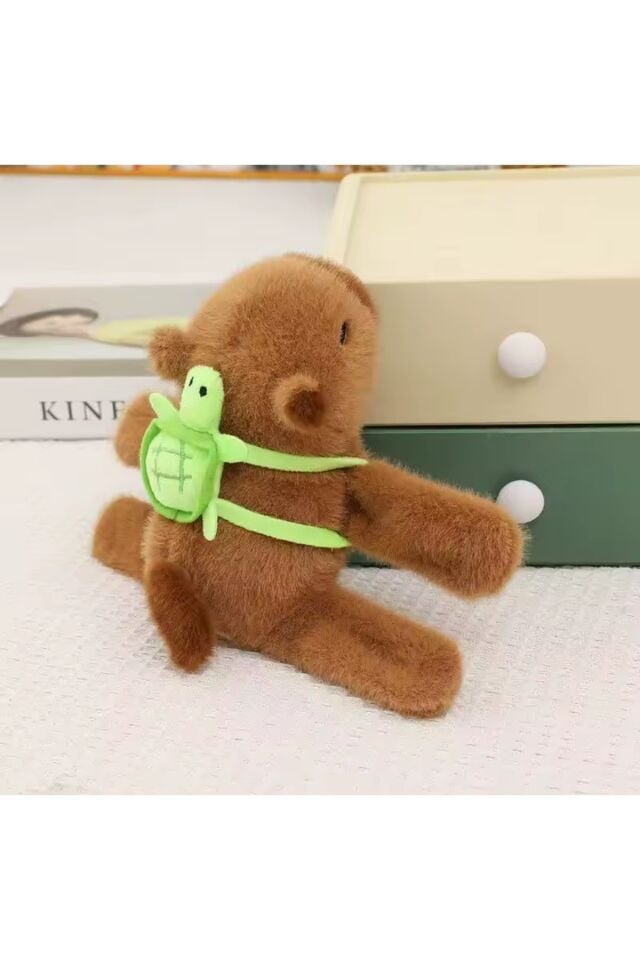 Capybara peluş oyuncak kol bantlı kapibara kuyruğu dönen yeşil sulfat kola takılan sarılan